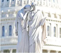  ?? — Reuters photo ?? The figures of Grief and History stand on top of the Peace Statue near the US Capitol.