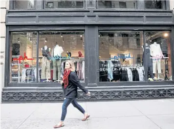  ?? REUTERS ?? A woman walks past Phluid, a new retail shop billed as ‘the world’s first gender-free store’, in New York on May 18, 2018.