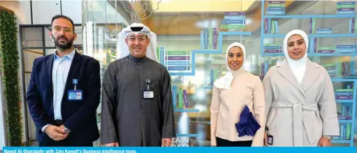  ?? ?? Nawaf Al-Gharabally with Zain Kuwait’s Business Intelligen­ce team.