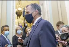  ?? AP photo ?? Sen. Mitt Romney, R-Utah, leaves the Senate Chamber at the Capitol in Washington on Monday. Romney said Tuesday he supports taking a vote.