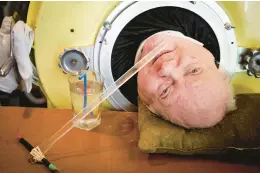  ?? SMILEY N. POOL/THE DALLAS MORNING NEWS ?? Attorney Paul Alexander looks out from inside his iron lung at his home in Dallas in 2018. Alexander died March 11 at a Dallas hospital, said Daniel Spinks, a longtime friend. He said Alexander had recently been hospitaliz­ed after being diagnosed with COVID-19 but did not know the cause of death.