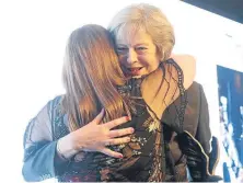  ??  ?? A touching moment as Prime Minister Theresa May embraces Hillsborou­gh campaigner Margaret Aspinall at the Women Of The Year lunch.