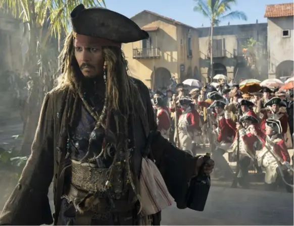  ?? PETER MOUNTAIN/DISNEY ?? Johnny Depp’s Captain Jack Sparrow is landlocked, broke and poutingly miserable in the fun new Pirates of the Caribbean: Dead Men Tell No Tales film.