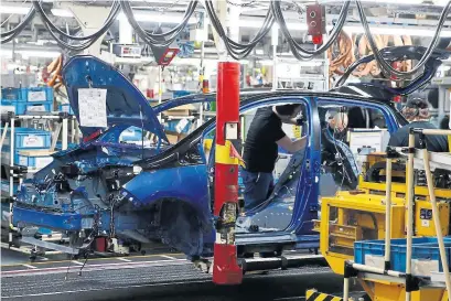  ?? PASCAL ROSSIGNOL/AGENCE FRANCE-PRESSE ?? A Yaris assembly line at Toyota's car plant in Onnaing, northern France.