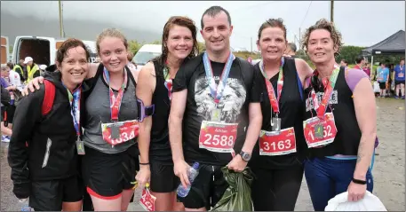  ?? Photo by Declan Malone ?? In 2004, Adrian O’Connor (centre) was told he would never walk again. On Saturday he completed his sixth Dingle Half Marathon in a row and with him at the finishing line in Dún Chaoin were his fellow ‘Below The Hill’ runners Cathy de Barra, Michelle...