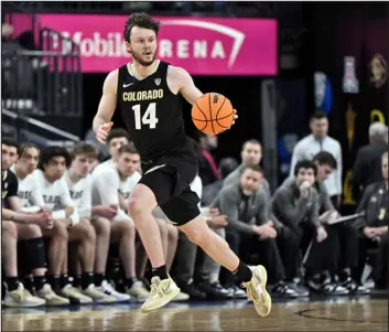  ?? DAVID BECKER — THE ASSOCIATED PRESS ?? Colorado guard Ethan Wright brings the ball up the court against UCLA during Thursday’s Pac-12 tournament quarterfin­al in Las Vegas.