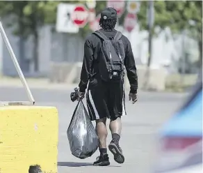  ?? TROY FLEECE ?? Former Saskatchew­an Roughrider­s running back Jerome Messam leaves Mosaic Stadium in Regina. Messam is not allowed to sign with any other CFL team after being charged with voyeurism.