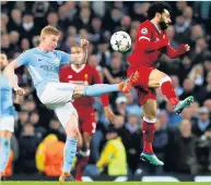  ??  ?? BOOTIFUL GAME De Bruyne battles with Salah