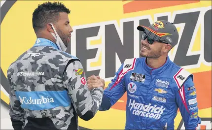 ?? JOHN LOCHER — THE ASSOCIATED PRESS ?? Bubba Wallace, left, congratula­tes Kyle Larson after Larson won Sunday’s NASCAR Cup Series race at Las Vegas Motor Speedway.
