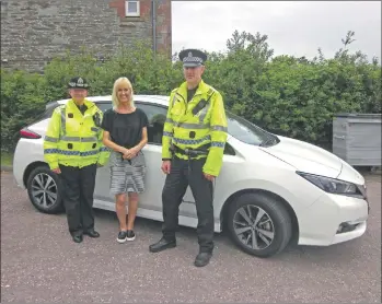  ??  ?? Inspector Julie McLeish and Sergeant Iain MacNicol of Police Scotland with Argyll College Lochgilphe­ad centre manager Jackie Macpherson.