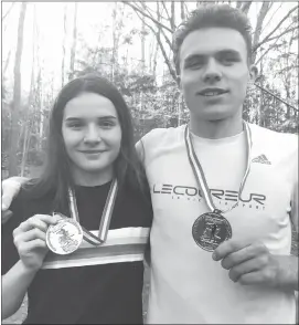  ?? MATTHEW MCCULLY ?? Lennoxvill­e residents Pauline and big brother Leo Grandbois recently picked up matching gold medals at the National Biathlon Championsh­ips, held at the end of March in Charlo, New Brunswick.