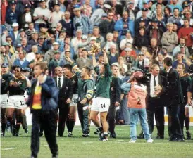  ?? /Jon Hrusa/Sunday Times ?? Star power: The Springboks celebrate winning the Rugby World Cup in 1995 at Ellis Park Stadium. In earlier decades, conditions for sports writers were far from glamorous.