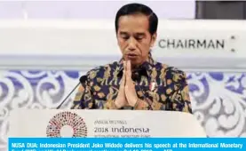  ??  ?? NUSA DUA: Indonesian President Joko Widodo delivers his speech at the Internatio­nal Monetary Fund (IMF) and World Bank annual meetings on Oct 12, 2018. — AFP