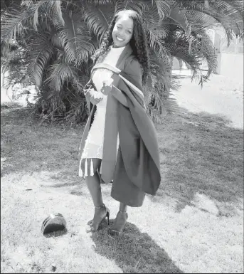  ??  ?? Osiola Gilbert-Chilcott in her graduation gown