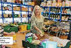  ?? ?? Volunteers from Hinckley and Rugby Building Society at the food bank