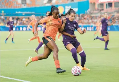  ?? CARMEN MANDATO/GETTY ?? Emily Madril, right, battles for ball control against the Dash’s Michelle Alozie during a June 3 game in Houston. Madril is Orlando’s top draft pick out of FSU where she won two national titles and was ACC Defensive Player of the Year in 2021.