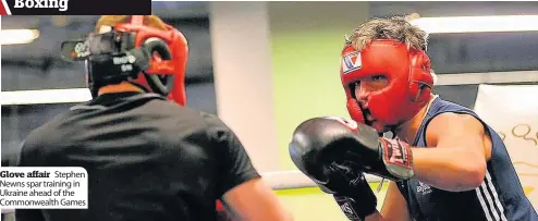  ??  ?? Glove affair Stephen Newns spar training in Ukraine ahead of the Commonweal­th Games