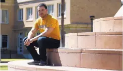  ?? ROSS D. FRANKLIN/ASSOCIATED PRESS ?? Arizona State University student David Montenegro sits in front of the library on the campus in Tempe earlier this month. A state Supreme Court decision has eliminated his in-state tuition break.