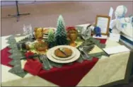  ?? RICHARD SMITH VIA AP ?? This photo provided by Richard Smith shows Andrea Smith’s award winning tablescape which depicts the contest theme of “High Country Celebratio­ns,” and is titled “Flatlander’s Welcome - A Taste of the Mountains,” at the Creative Colorado Table Setting...