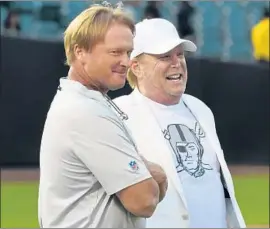  ?? Thearon W. Henderson Getty Images ?? COACH Jon Gruden, left, and owner Mark Davis of the Oakland Raiders hope to revive the team’s “commitment to excellence” on the 50-year anniversar­y of 1968.