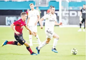  ?? — AFP photo ?? Gareth Bale (second left) of Real Madrid in action during the Internatio­nal Champions Cup match against Manchester United at Hard Rock Stadium in Miami, Florida.