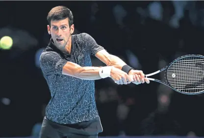  ?? Picture: Getty Images. ?? Top seed Novak Djokovic in action in his opening group match with John Isner.