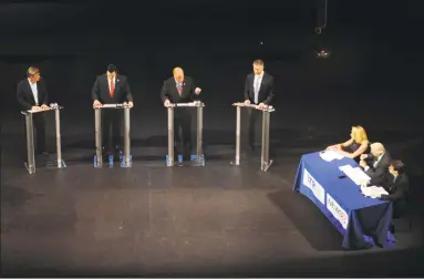  ?? Michael Cummo / Hearst Connecticu­t Media ?? Danbury mayor Mark Boughton speaks during the Republican governor debates, hosted by the Connecticu­t Realtors Assocation, inside the Shubert Theater in New Haven on Monday. Also pictured, from left, Steve Obsitnik, former Trumbull First Selectman Tim Herbst and David Stemerman.