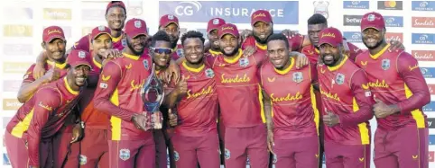  ?? (Photos: AFP) ?? The West Indies team celebrates with the trophy after winning the third and final One-day Internatio­nal match between West Indies and Sri Lanka at Vivian Richards Stadium in North Sound, Antigua, on March 14, 2021.