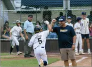 ?? COURTESY ERIC STROHM ?? Upper Providence coach Ben Ludwig celebrates with Tommy Sergio after his go-ahead home run in the state semifinal game.