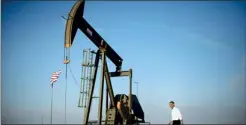  ??  ?? U.S. President Barack Obama walks past a pumpjack on his way to deliver remarks on energy independen­ce(reuters)