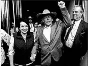  ?? K.M. CANNON/LAS VEGAS REVIEW JOURNAL ?? Cliven Bundy walks out of federal court with his wife, Carol, on Monday in Las Vegas, after a judge dismissed charges.