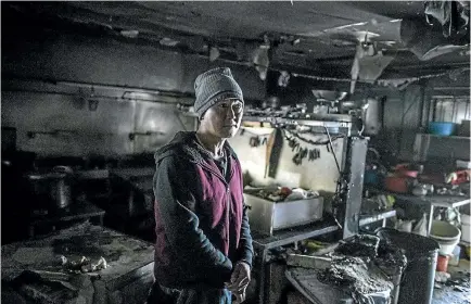  ?? PHOTO: IAIN MCGREGOR/STUFF ?? Foo San co-owner Sam Soh yesterday in the charred kitchen where a devastatin­g fire had started on Sunday.