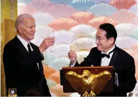  ?? Photograph: Evelyn Hockstein/Reuters ?? US President Joe Biden joins Japan prime minister Fumio Kishida in a toast at an official state dinner at the White House in Washington.