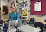  ?? JOHN SEEWER — THE ASSOCIATED PRESS ?? Katie Peters, an English teacher at Whitmer High School, poses in her classroom on Monday in Toledo, Ohio.