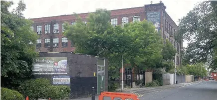  ??  ?? Houldswort­h Street, in Reddish, where yobs are setting the road alight. They are hiding in the derelict Elisabeth Mill when firefighte­rs arrive