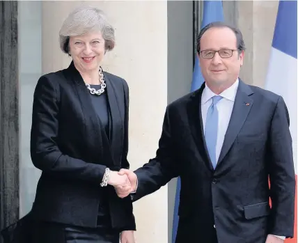  ??  ?? > Prime Minister Theresa May meets French President Francois Hollande at the Elysee Palace, Paris, yesterday evening