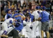  ?? MATT RYERSON — THE ASSOCIATED PRESS ?? Florida players celebrate after defeating LSU in Game 2 to win the NCAA College World Series in Omaha, Neb., Tuesday.
