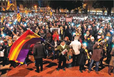  ?? LLUIS GENE/AFP ?? People take part in a demonstrat­ion in Barcelona against the trial of former Catalan separatist leaders on Tuesday.