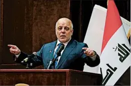  ?? KARIM KADIM/AP ?? Prime Minister Haider al-Abadi announces Iraq’s victory Saturday in an address to the nation aired on state television. Later his office declared a public holiday for Sunday.