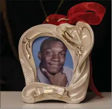  ?? LIBBY O’NEILL — BOSTON HERLAD ?? A framed photo of Roderick “Kito” Jackson rests on the table during the press conference in Boston on Friday.