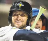  ?? Sean Rayford / Associated Press ?? Tim Tebow’s presence on the Columbia Fireflies’ roster has led to a spike in attendance for their South Atlantic League games both at home and on the road.