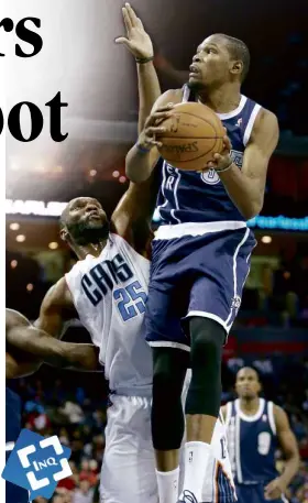  ?? AFP ?? KEVIN Durant ofOklahoma City Thunder drives against Al Jefferson of the Charlotte Bobcats in theirmatch at North Carolina.