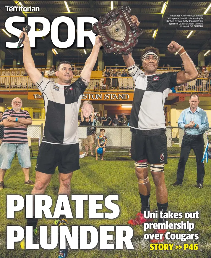  ?? Picture: GLENN CAMPBELL ?? University University’s s Wayne Robinson and Wise Sekitoga raise the shield after winning the Northern Territorye­rritoryy Rugbyg y Union grandg final against theheh Casuarina Cougars last night.