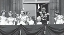  ?? (File Photo/AP) ?? Queen Elizabeth II waves from the balcony of Buckingham Palace on June 2, 1953, following her coronation at Westminste­r Abbey. Also waving are Prince Philip, the Duke of Edinburgh; Prince Charles; and Princess Anne. Queen Elizabeth, the Queen Mother, is seen at far right.