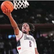  ?? MARY ALTAFFER/AP PHOTO ?? UConn guard Tristen Newton goes to the basket during the first half of the team’s NCAA college basketball game against St. John’s in the semifinals of the Big East men’s tournament Friday in New York.