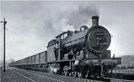  ?? JOhN hUNt ?? aBOVE: Despite the ‘no parking’ sign, ‘Q6’ No. 63395 is coaled on the level crossing at Grosmont on June 27 1970 – two days after it had arrived on the line.