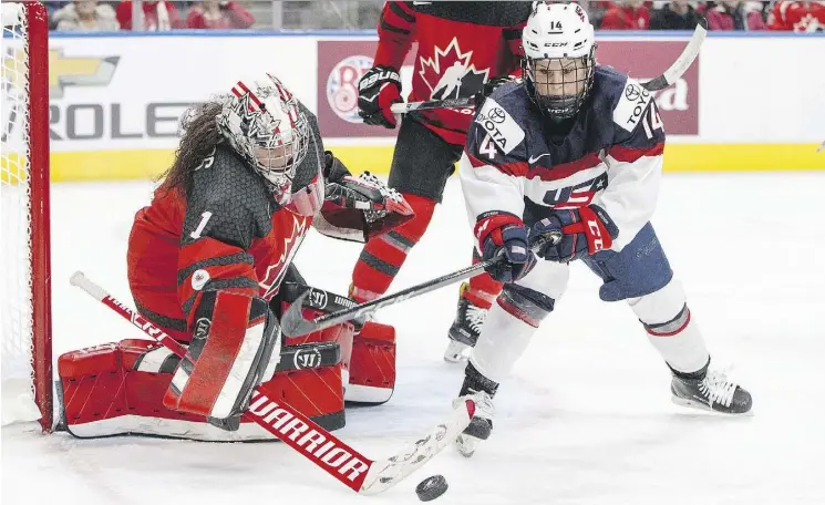  ?? JASON FRANSON/THE CANADIAN PRESS ?? Canada’s Shannon Szabados makes a save on Team USA’s Brianna Decker during Sunday’s national women’s team hockey action at Rogers Place.