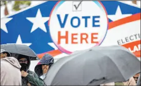  ?? Erik Verduzco Las Vegas Review-journal ?? Nevadans wait in line on Nov. 8 to cast their votes for the 2022 midterms at the Centennial Hills polling location in the northwest valley.