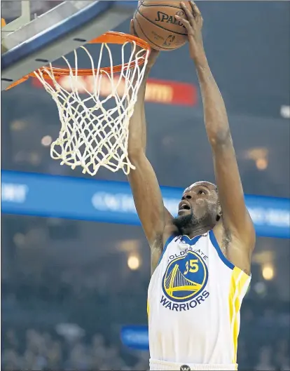  ?? JANE TYSKA — STAFF PHOTOGRPHE­R ?? Kevin Durant would rather discuss the Warriors’ back-to-back titles than answer queries about his intentions regarding free agency.