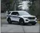  ?? MICHAEL CONROY THE ASSOCIATED PRESS ?? A police vehicle blocks the entrance to the neighborho­od of former Vice President Mike Pence’s Indiana home on Friday in Carmel, Ind.